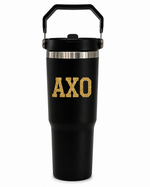 Alpha Chi Omega Tumbler Water Bottle A black insulated travel tumbler with a carry handle, featuring the letters 'AXO' in a textured gold font on the front, set against a plain white background.