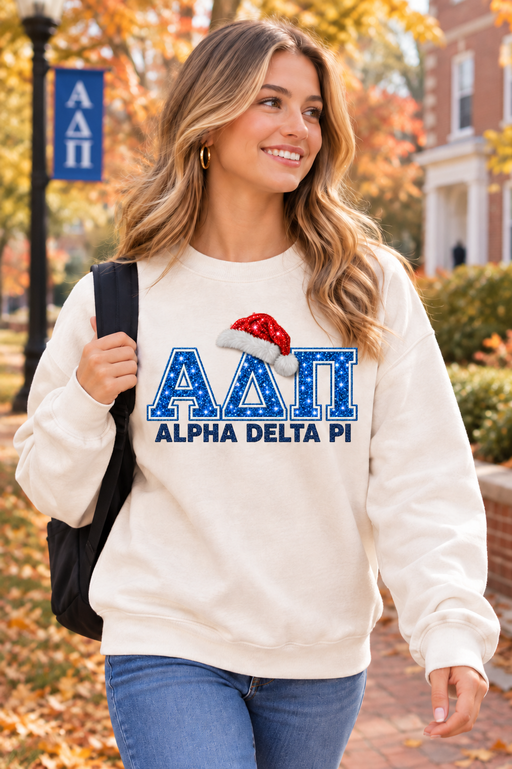 Alpha Delta Pi Santa Holiday Sweatshirt with blue glitter ΑΔΠ lettering and a red Santa hat